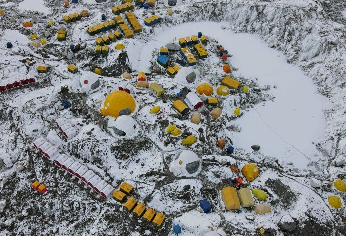 Hundreds of tents pitched on the Khumbu glacier, seen from the air.