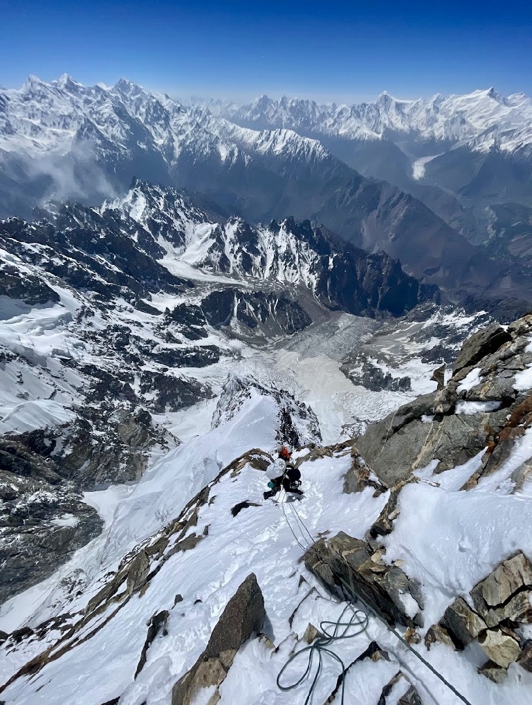 Sebastian Pelletti following below the rock pillar at 6,700m.