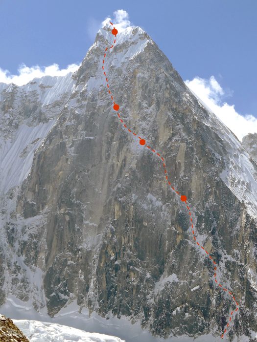 the new route marked in red of a photo of Jugal Spire's rocky north face.